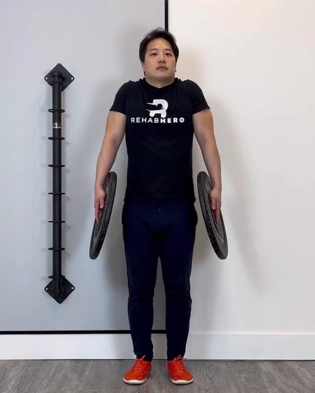 Plate Shrugs - upper trapezius and shoulder strengthening exercise