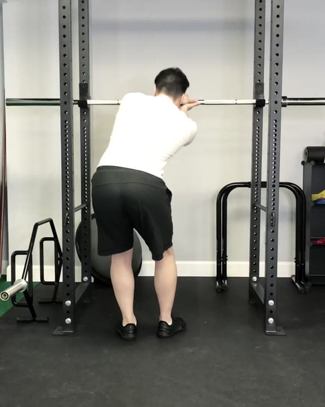 Try out this Lats Leaning Stretch to target the Latissimus Dorsi muscle before squatting